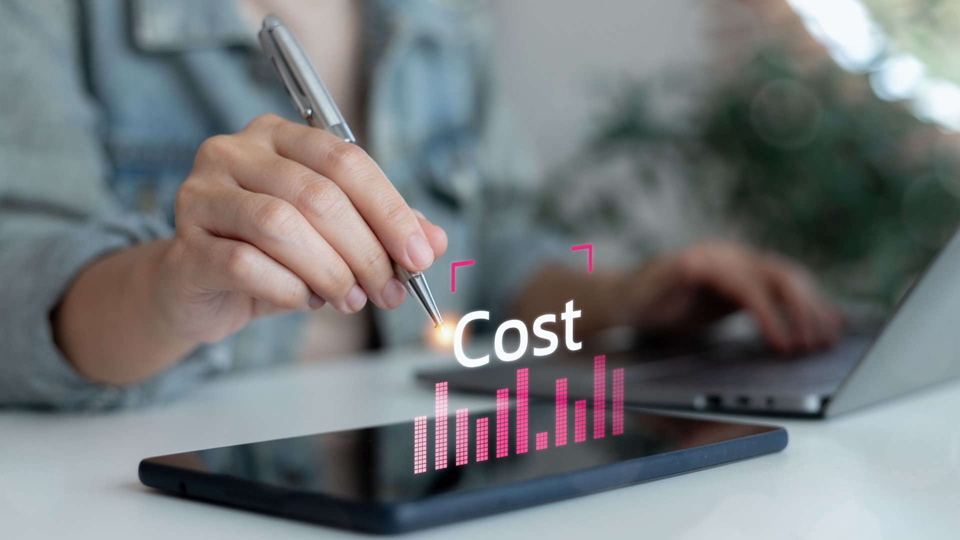 Business using a tablet with a digital cost graph for financial planning, management, investment strategy, and modern technology concept in digital economy and efficiency.