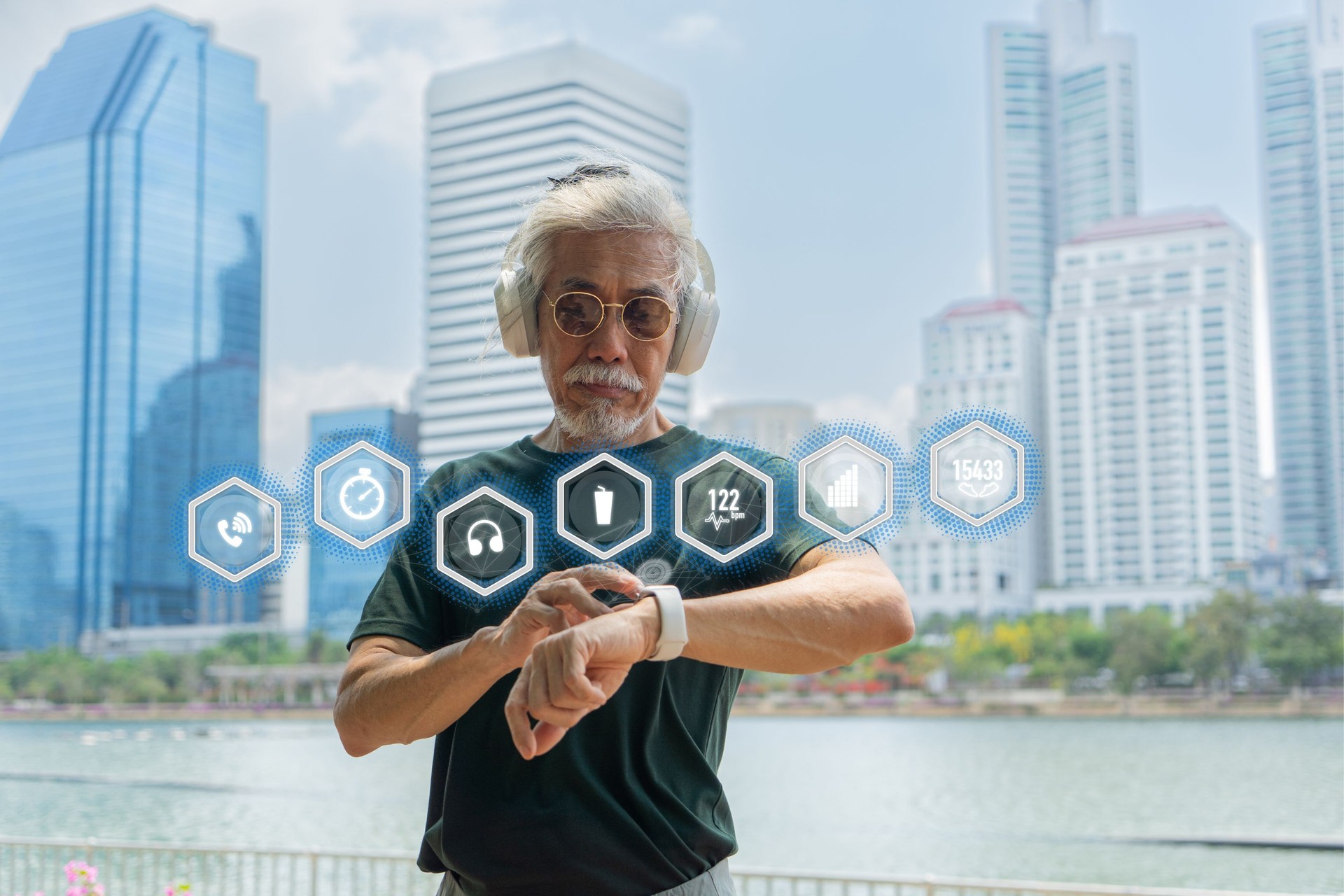 Asian senior men using smartwatch in public park