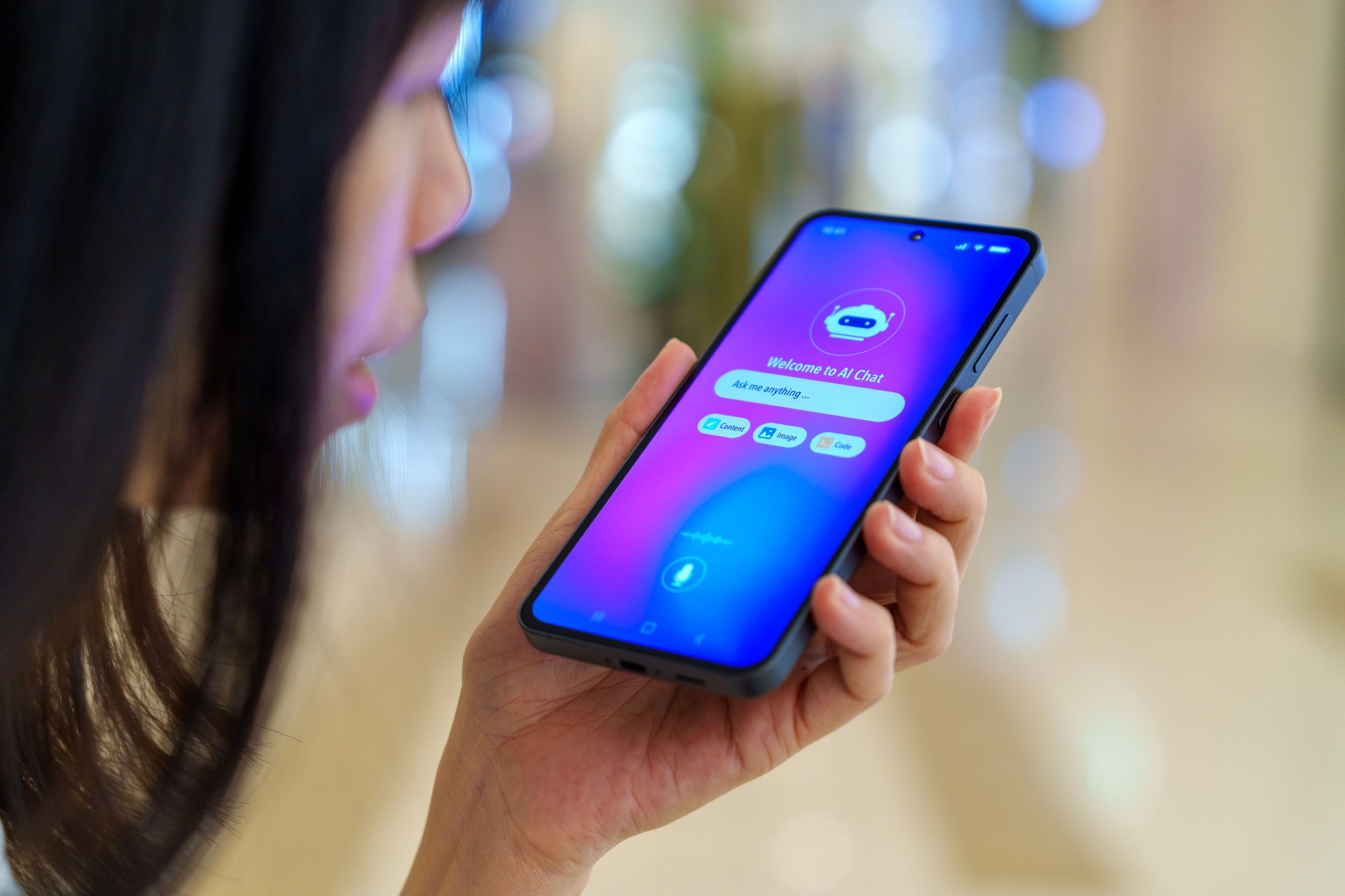 Woman using voice-based AI assistant on smartphone